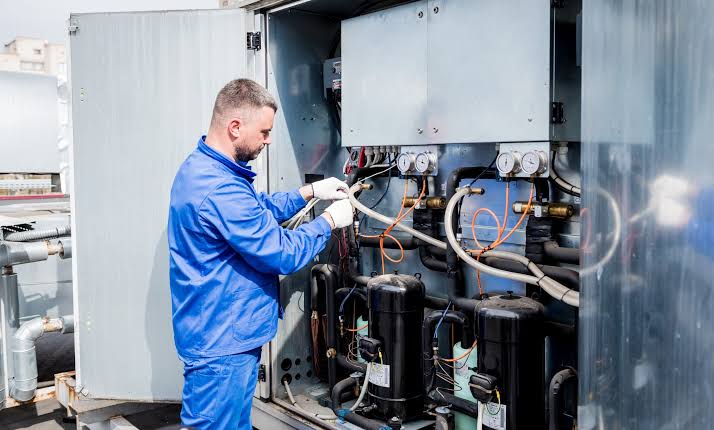 Technician checking a commercial HVAC system